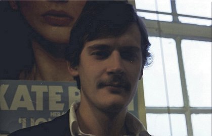 Martin Hance poses in front of the legendary Kate Bush poster
