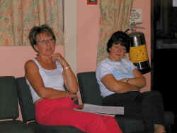 Linda wonders why Diane has an extinguisher growing out of her side
